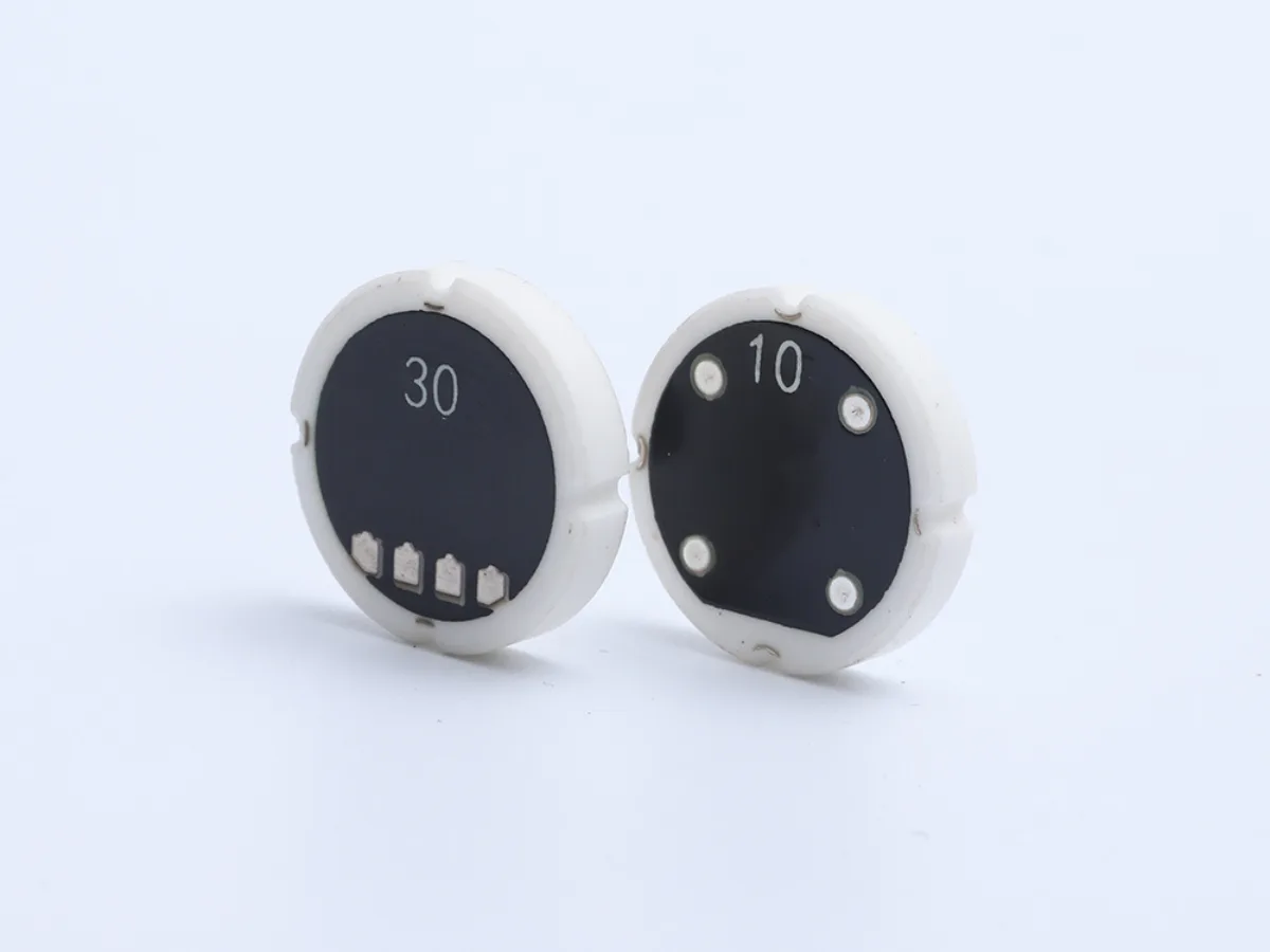 Two circular ceramic pressure sensing components from Zhixin Micro