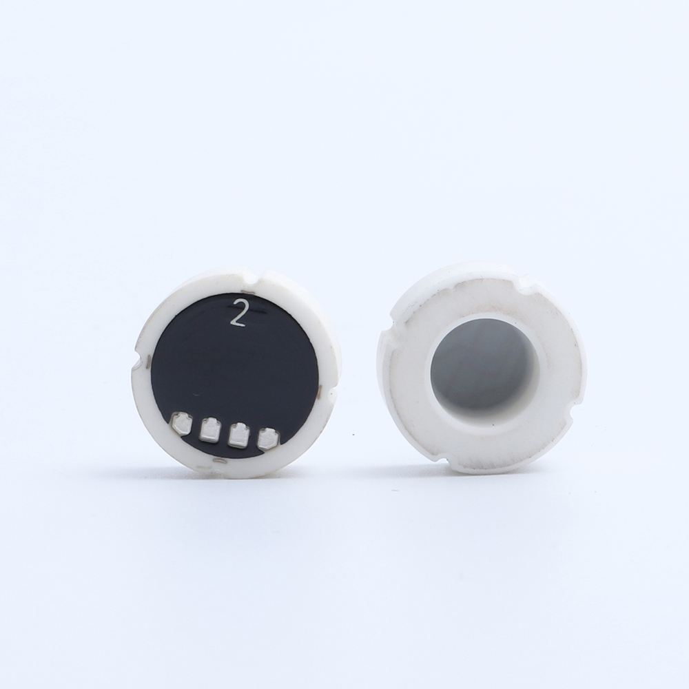 Ceramic pressure sensor cores showing the pressure-facing surface and electrical connection pads