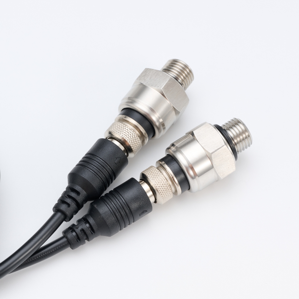 Two ZXW pressure transmitters with threaded pressure connections and electrical connectors with attached cables
